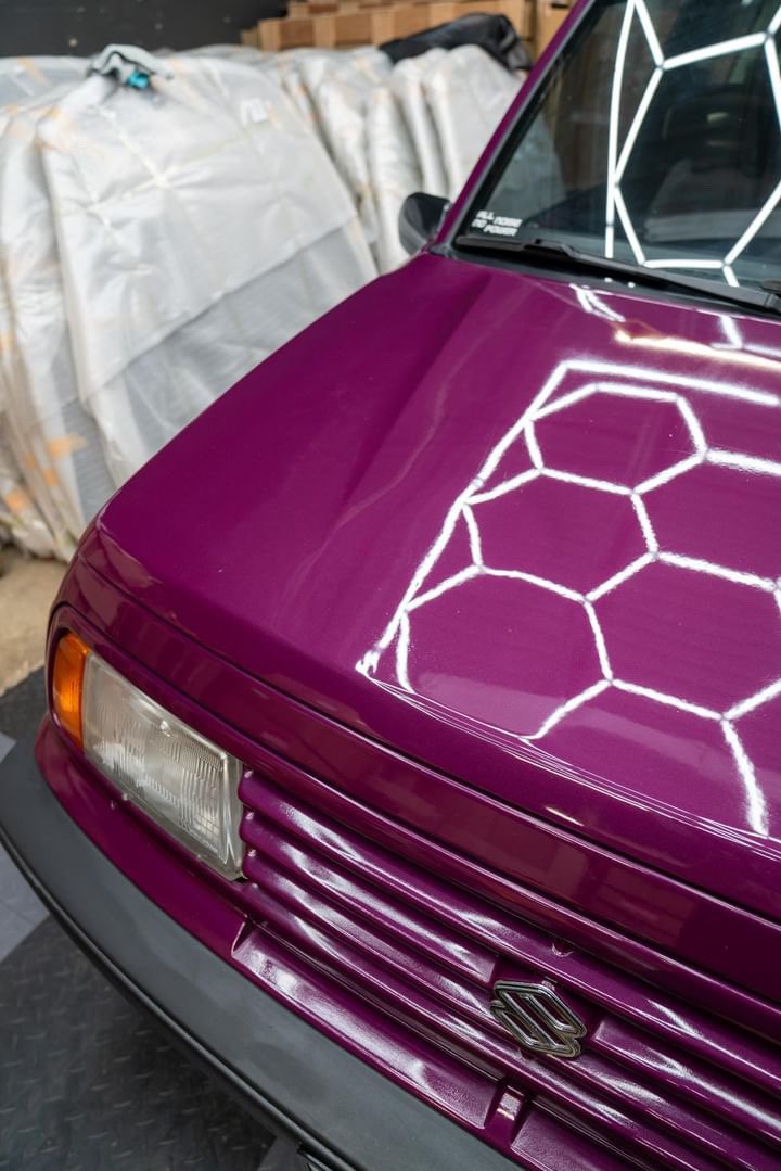 Side view of the purple Sidekick car, showcasing its high-gloss detailed paint finish, expertly detailed in Aurora, Illinois.