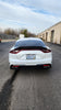 Rear angle perspective of the Kia Stinger with Jalisco's Carbon Half Trunk Spoiler, focusing on the spoiler's impact on the vehicle's rear aesthetic and its aerodynamic design.