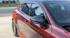 Side angle of Kia Stinger with Jalisco CF M-Style Mirror Cap, reflecting sleek design.