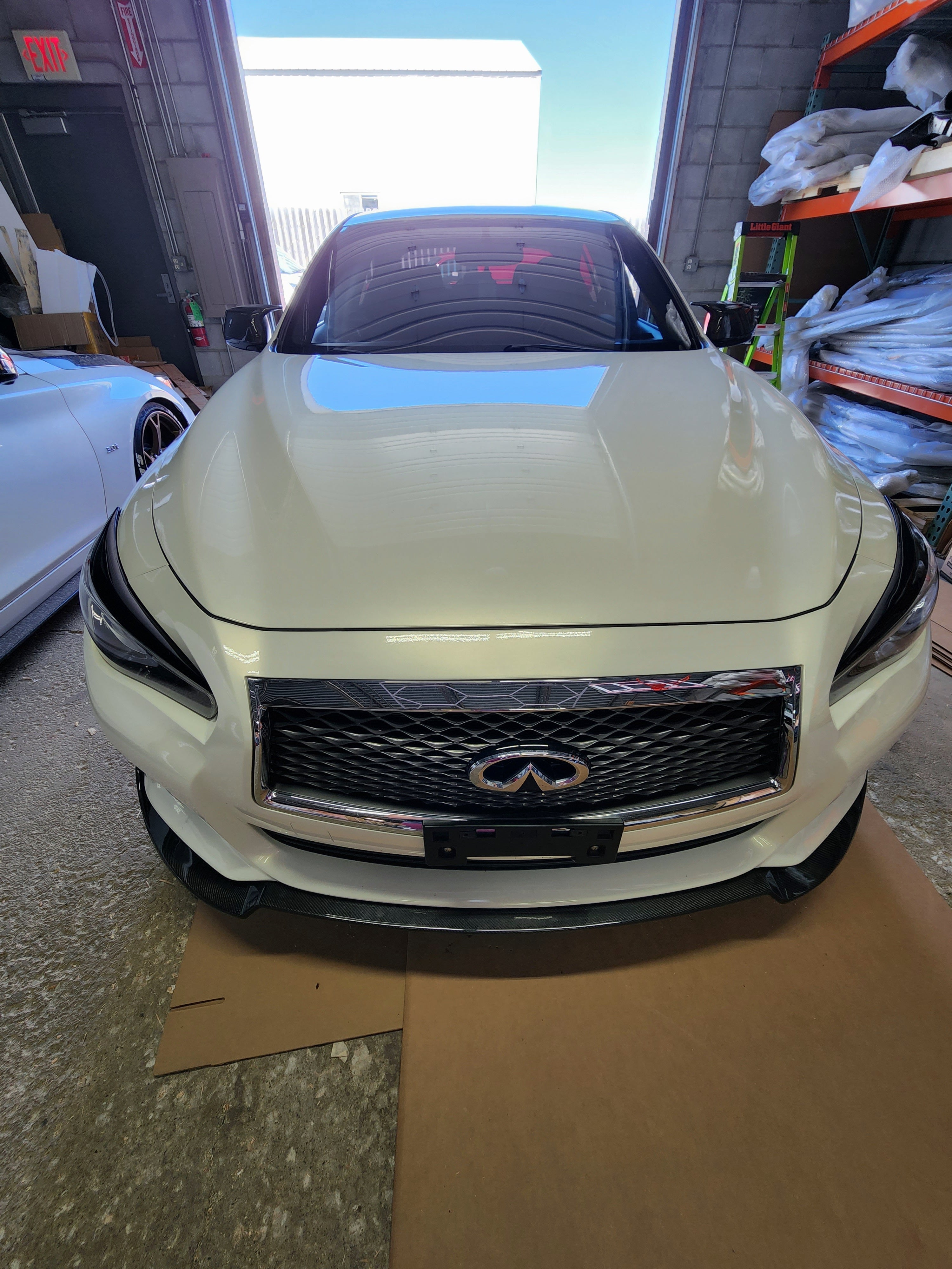 "Perspective view of Q50 with JCF Splitter, underlining the low-profile and race-inspired look.