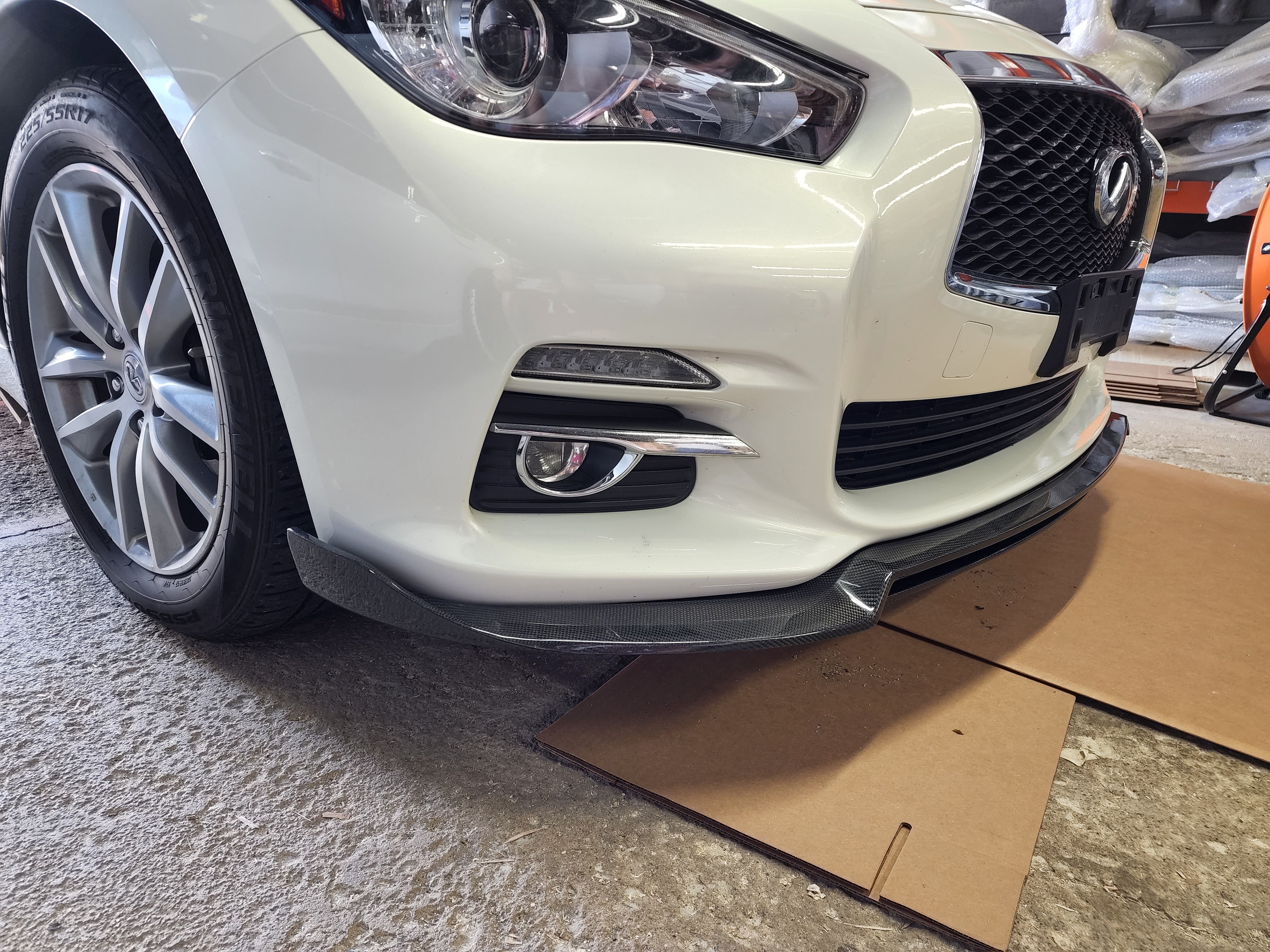 Dynamic view of Infiniti Q50 with JCF Front Lip Splitter, illustrating the enhanced front profile