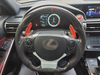 Carbon steering wheel with digital dashboard display inside a vehicle