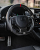Steering wheel with carbon fiber texture in a car interior