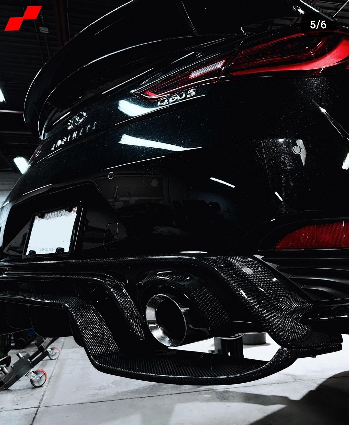 Close-up view of the JCF 2 Piece Carbon Fiber Diffuser for the Infiniti Q60, showing detailed carbon weave.