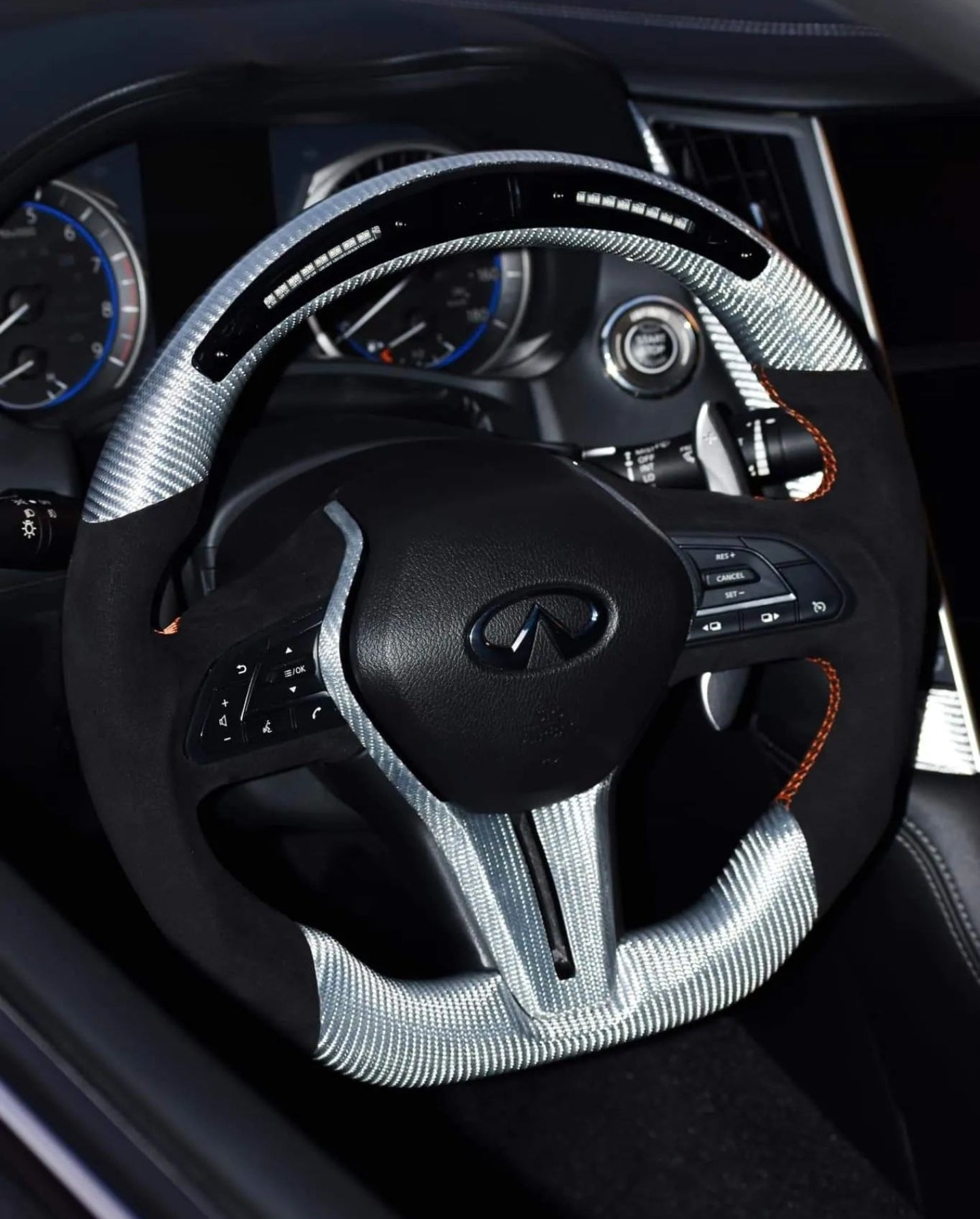 Jalisco's gray carbon fiber steering wheel with suede-like grips and LED screen top for Infiniti Q50/Q60.