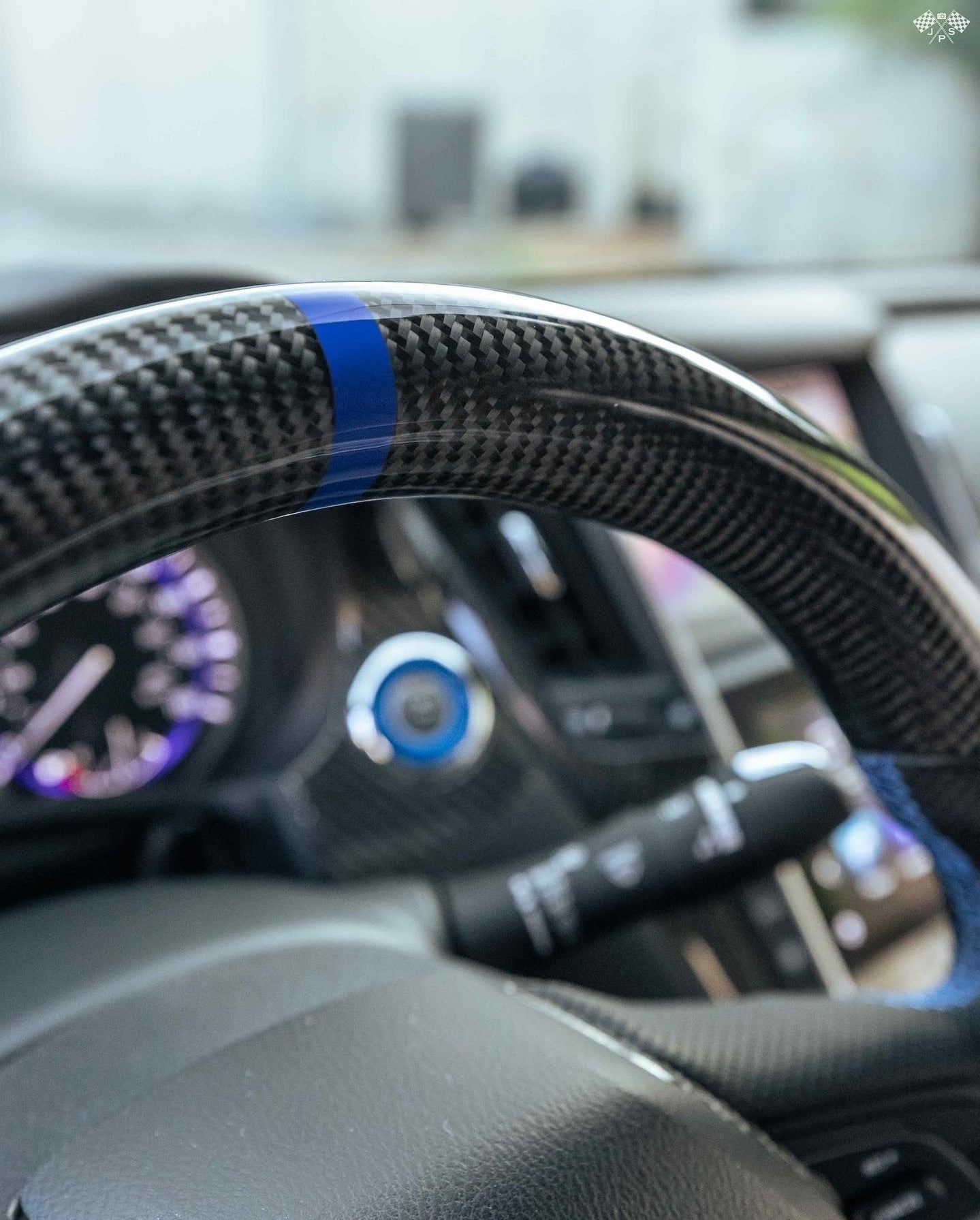 Close-up view of blue stripe on Jalisco's carbon fiber steering wheel for Infiniti Q50/Q60.