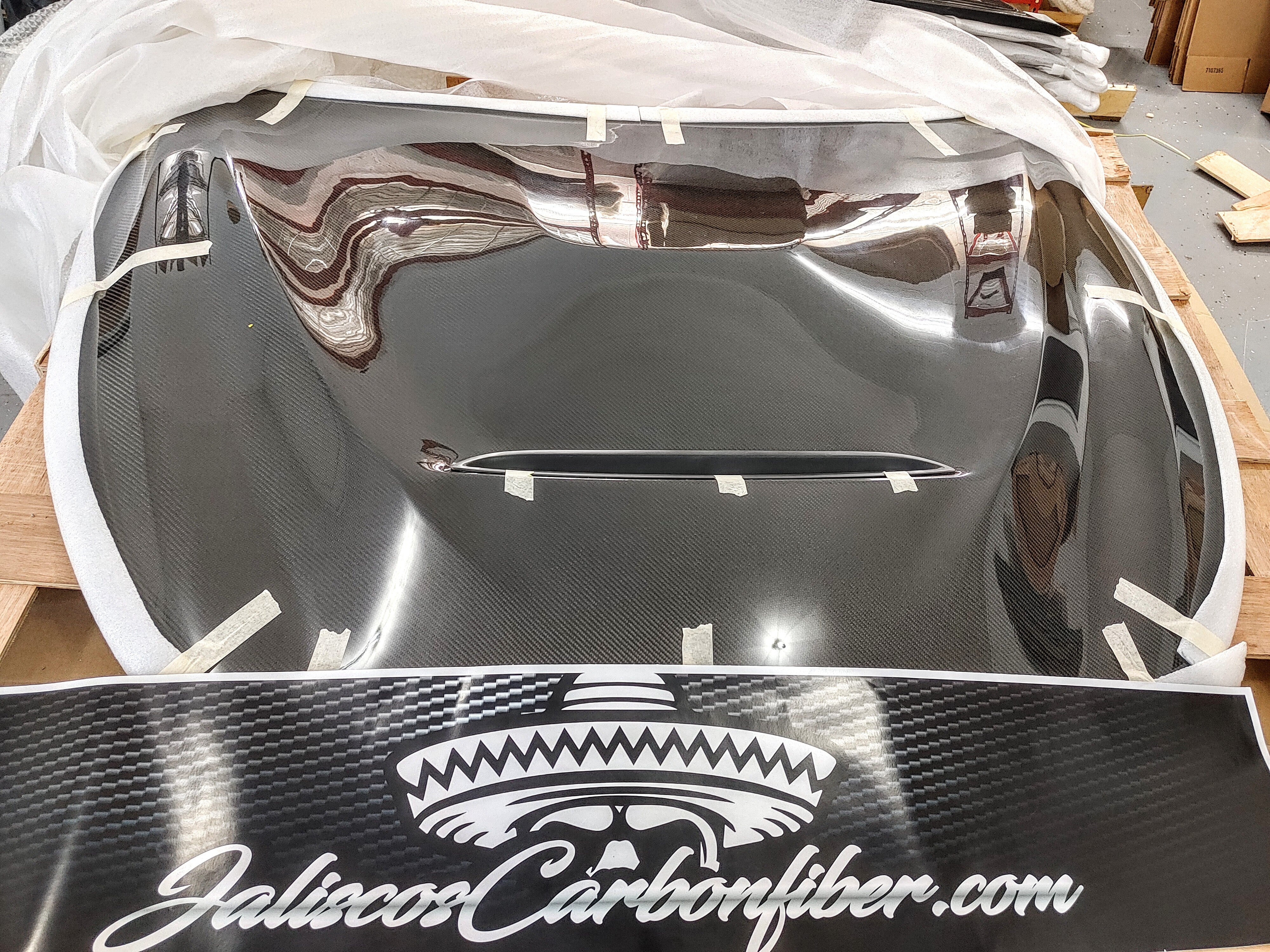 JCF Carbon Fiber Hood for Q60, wrapped and prepared for freight shipping from the warehouse.