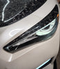 Close-up of Carbon Fiber Headlight Eyelid for Infiniti Q50 2014-2023, showcasing the high-quality material and texture.