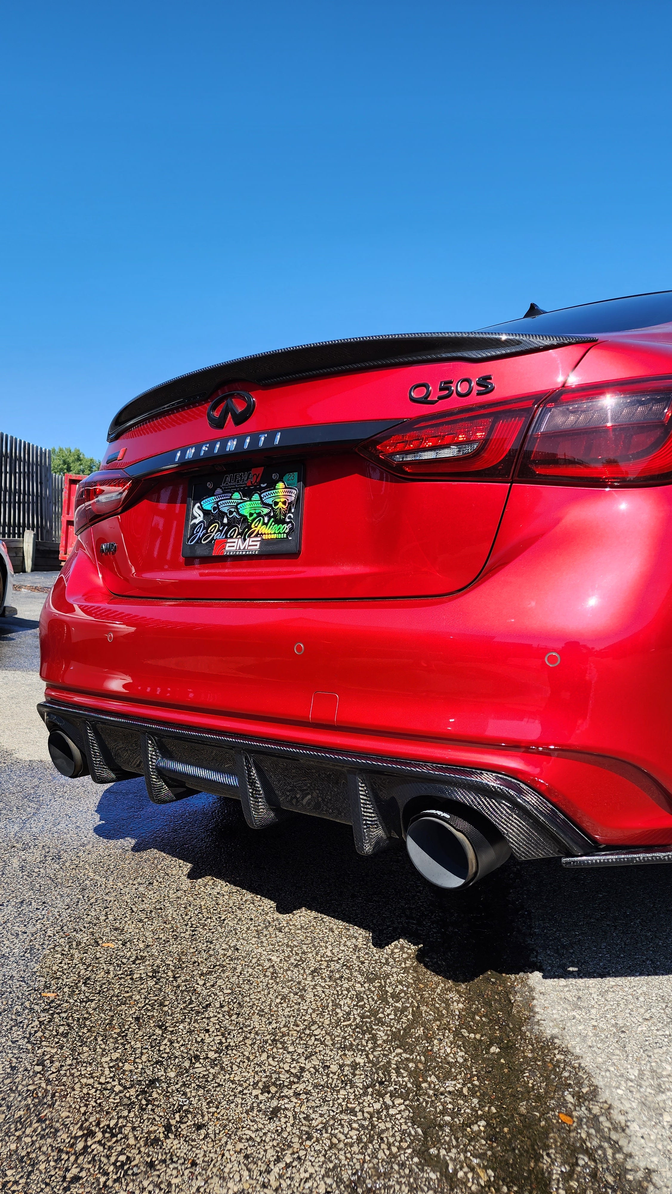 Red Infiniti Q50 2018 with Jalisco's CF Carbon Fiber 'OG' Style Diffuser, offering a unique perspective on its design