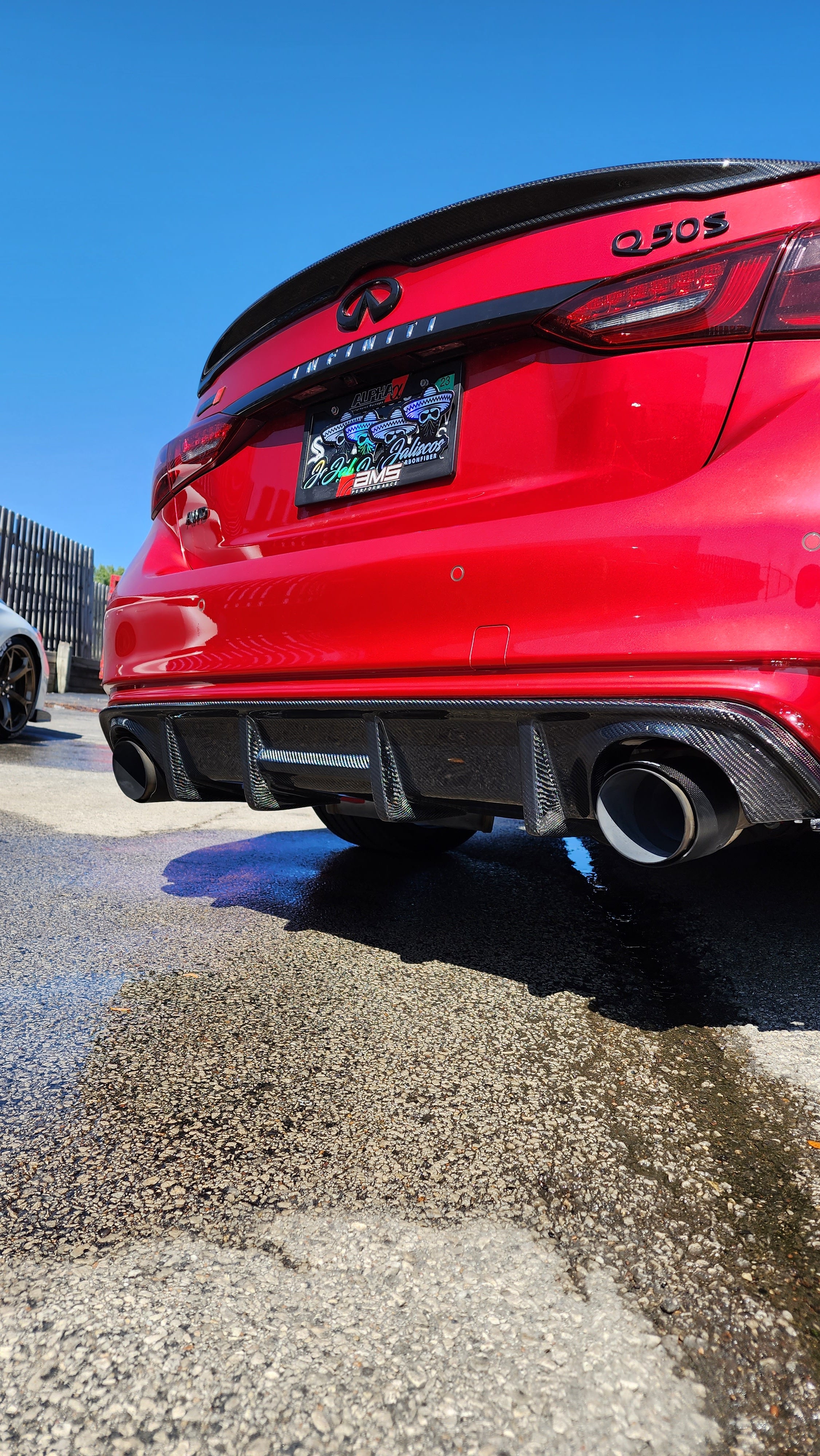 Alternate angle view of the red Infiniti Q50 2018 highlighting Jalisco's CF Carbon Fiber 'OG' Style Diffuser.