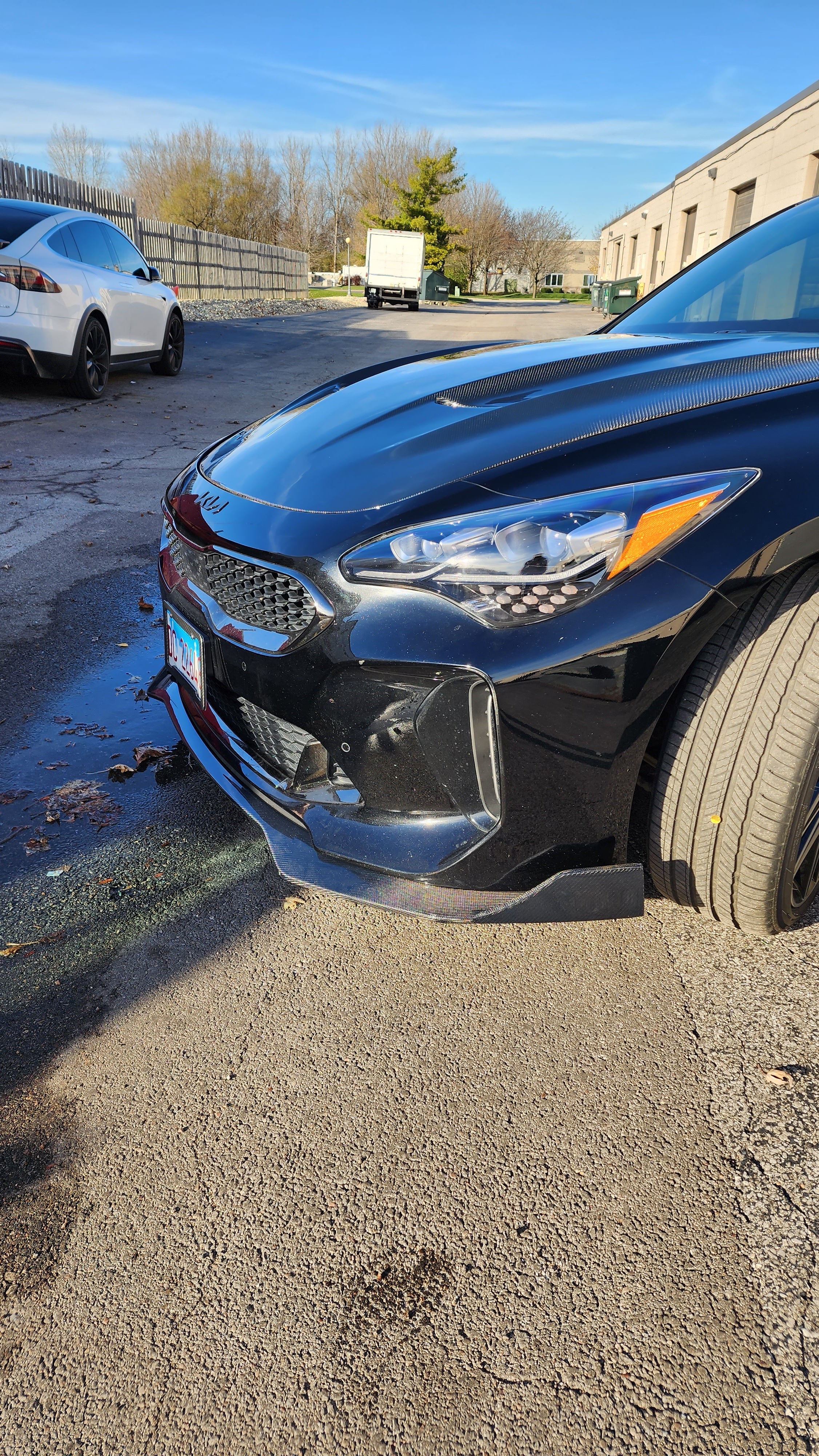 Front corner view of the Kia Stinger featuring Jalisco's Front Lip, highlighting the smooth transition of the lip with the car's side profile.