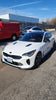 Load image into Gallery viewer, Slightly angled front view of the Kia Stinger with the Jalisco CarbonFiber Front Lip, showcasing the lip&#39;s enhancement of the car&#39;s aggressive stance