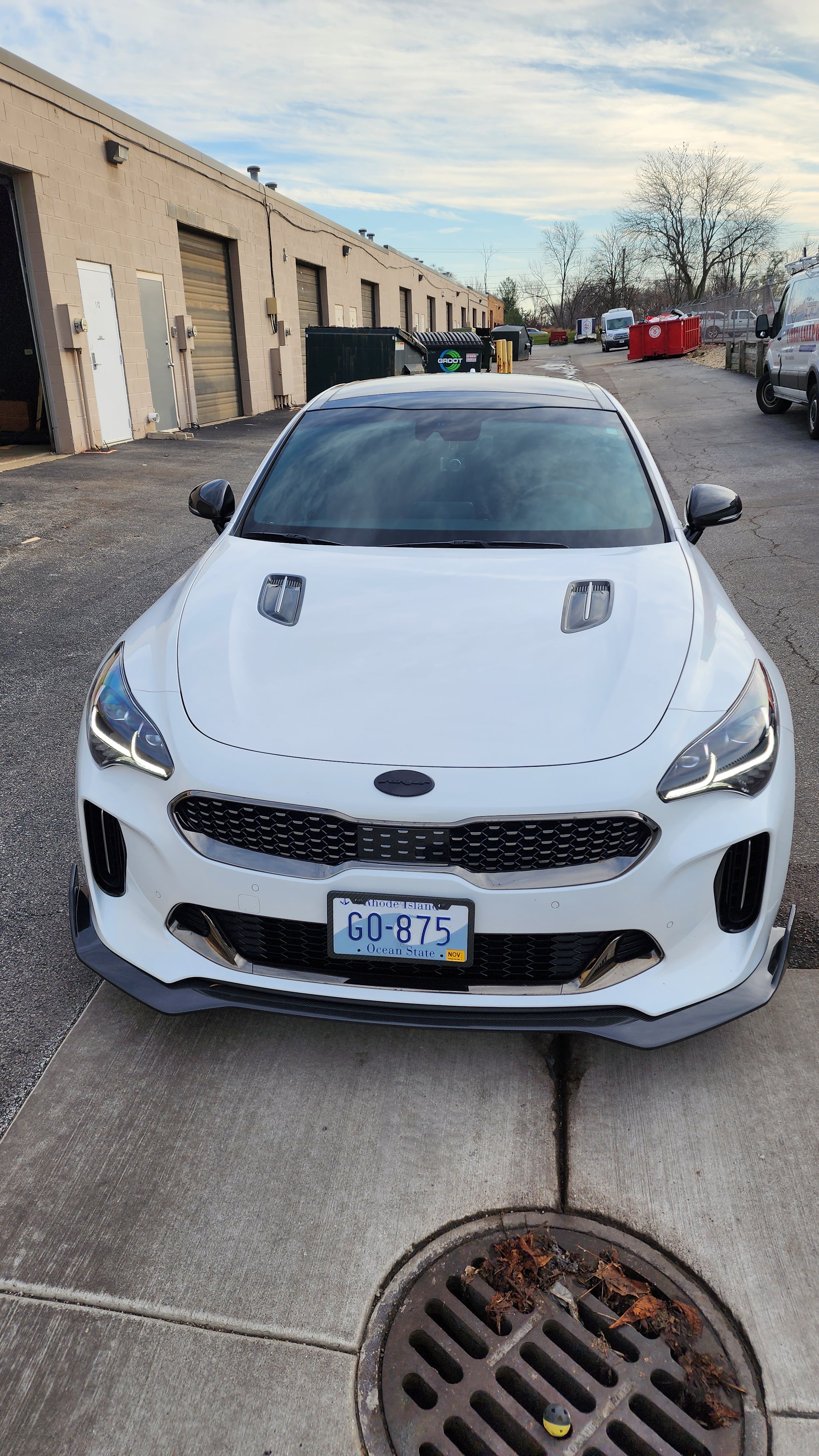 Frontal perspective of the Kia Stinger displaying Jalisco's CarbonFiber Front Lip, showing its impact on the vehicle's sporty appearance.