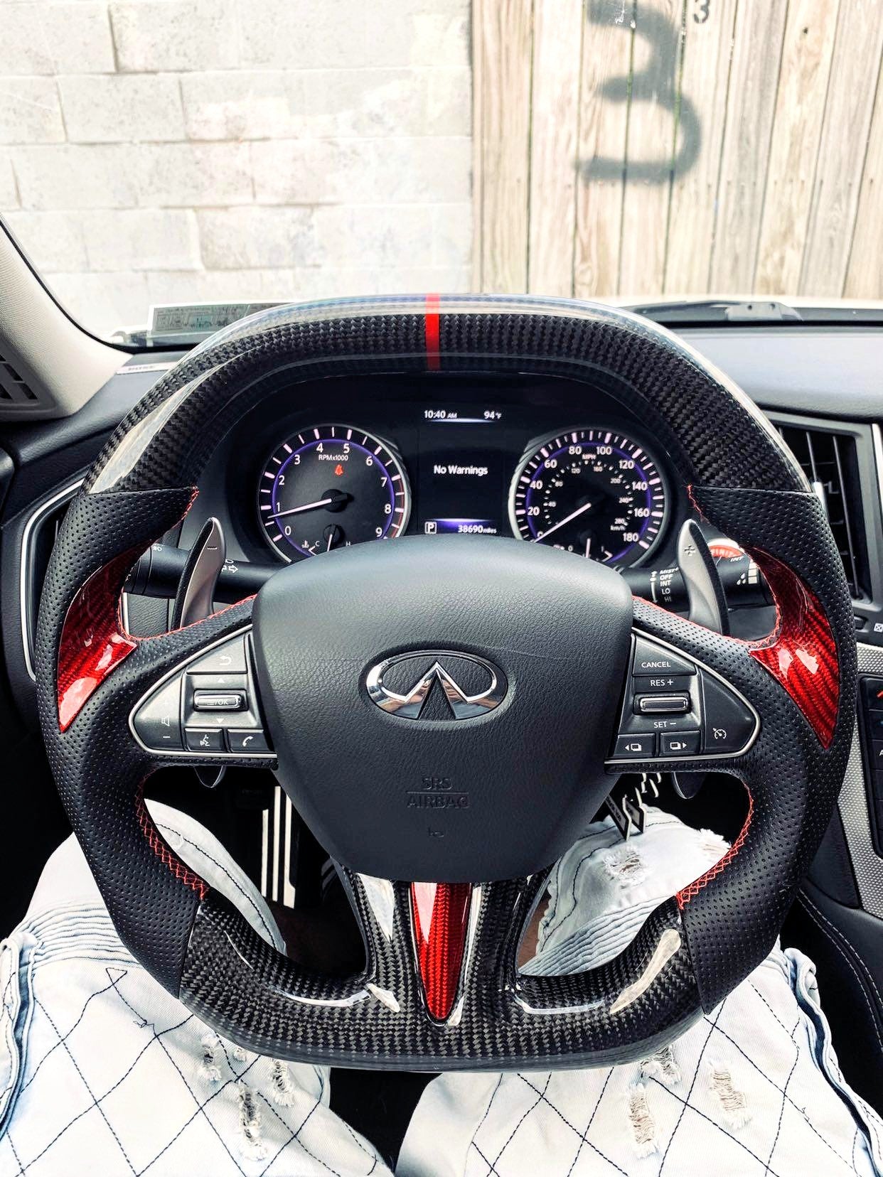 Racecar-inspired oval/rectangle CarbonFiber Steering Wheel for Infiniti Q50 2014-2017, featuring red accents, dark carbon fiber design, and a bold red stripe.