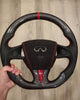 Load image into Gallery viewer, Traditional CarbonFiber Steering Wheel design with standard thumb holders, a red accent, red stitching, and a central red stripe for Infiniti Q50 2014-2017.