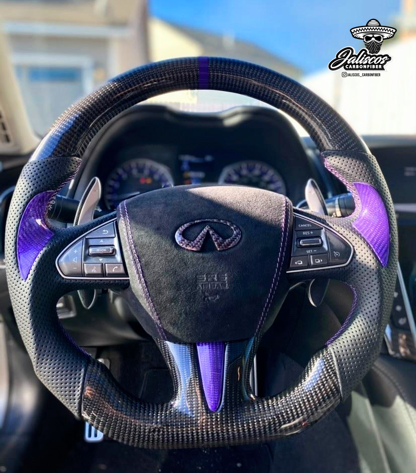 Jalisco's CarbonFiber Custom Steering Wheel for Infiniti Q50 2014-2017: Traditional carbon fiber design with leather grips, accented with purple thumb grip, stitching, and stripe.