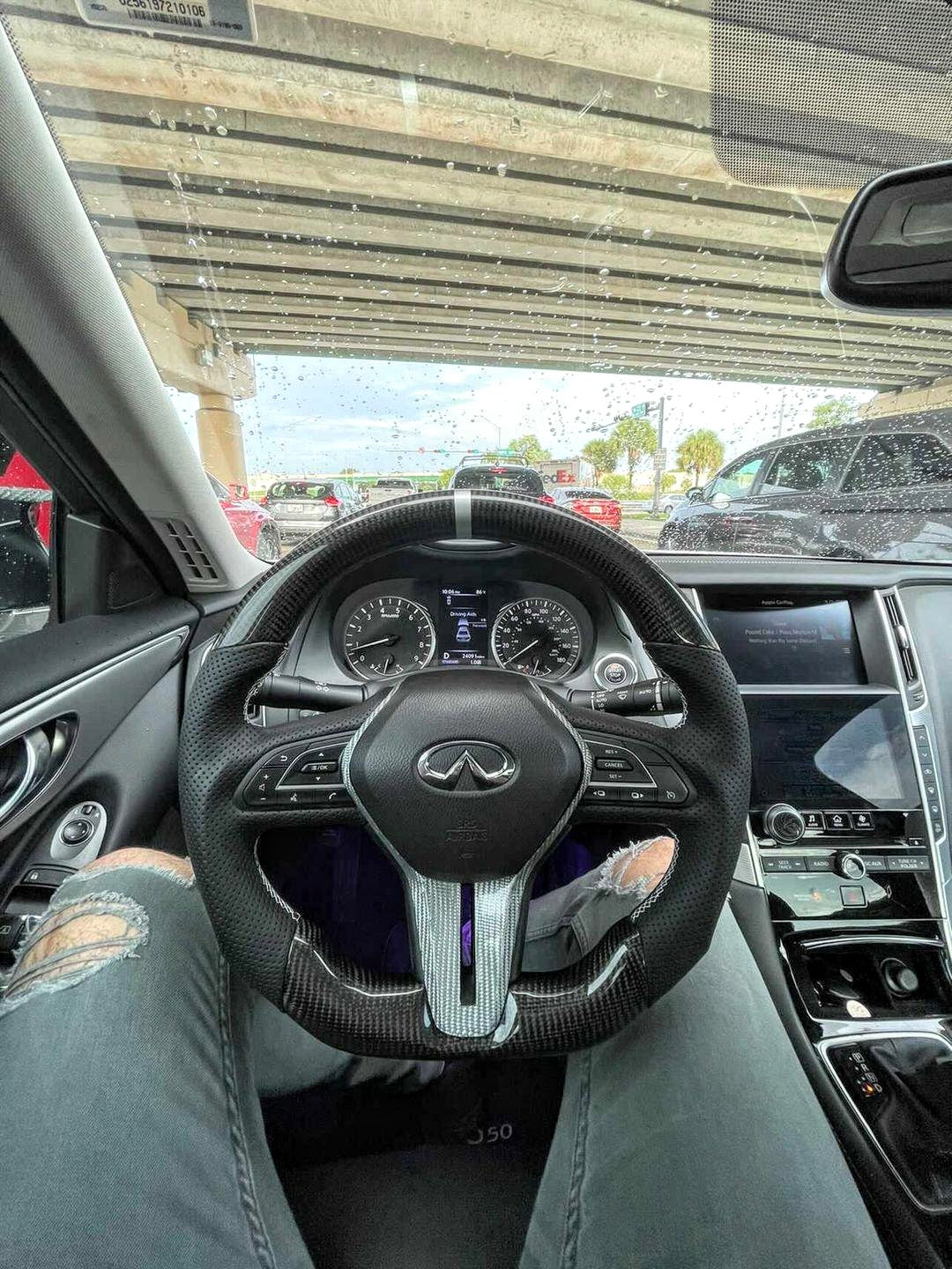 Jalisco's carbon fiber steering wheel with light gray accent, white stripe, and leather grip for Infiniti Q50/Q60