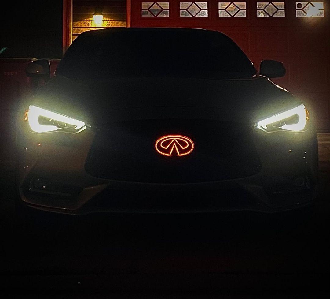 Infiniti Q60 with Jalisco's LED Logo-Emblem in blue, showing no light bleed on the grill