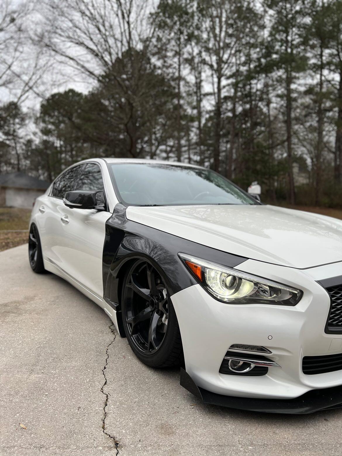 "Infiniti Q50 upgraded with JCF Vented Carbon Fiber Fenders, illustrating a fusion of style and function.