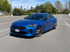 Load image into Gallery viewer, Side angle of Kia Stinger with Jalisco CF M-Style Mirror Cap, reflecting sleek design