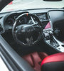 Wide view of Jalisco's forged carbon fiber steering wheel with suede grips and red stripe for Infiniti Q50/Q60